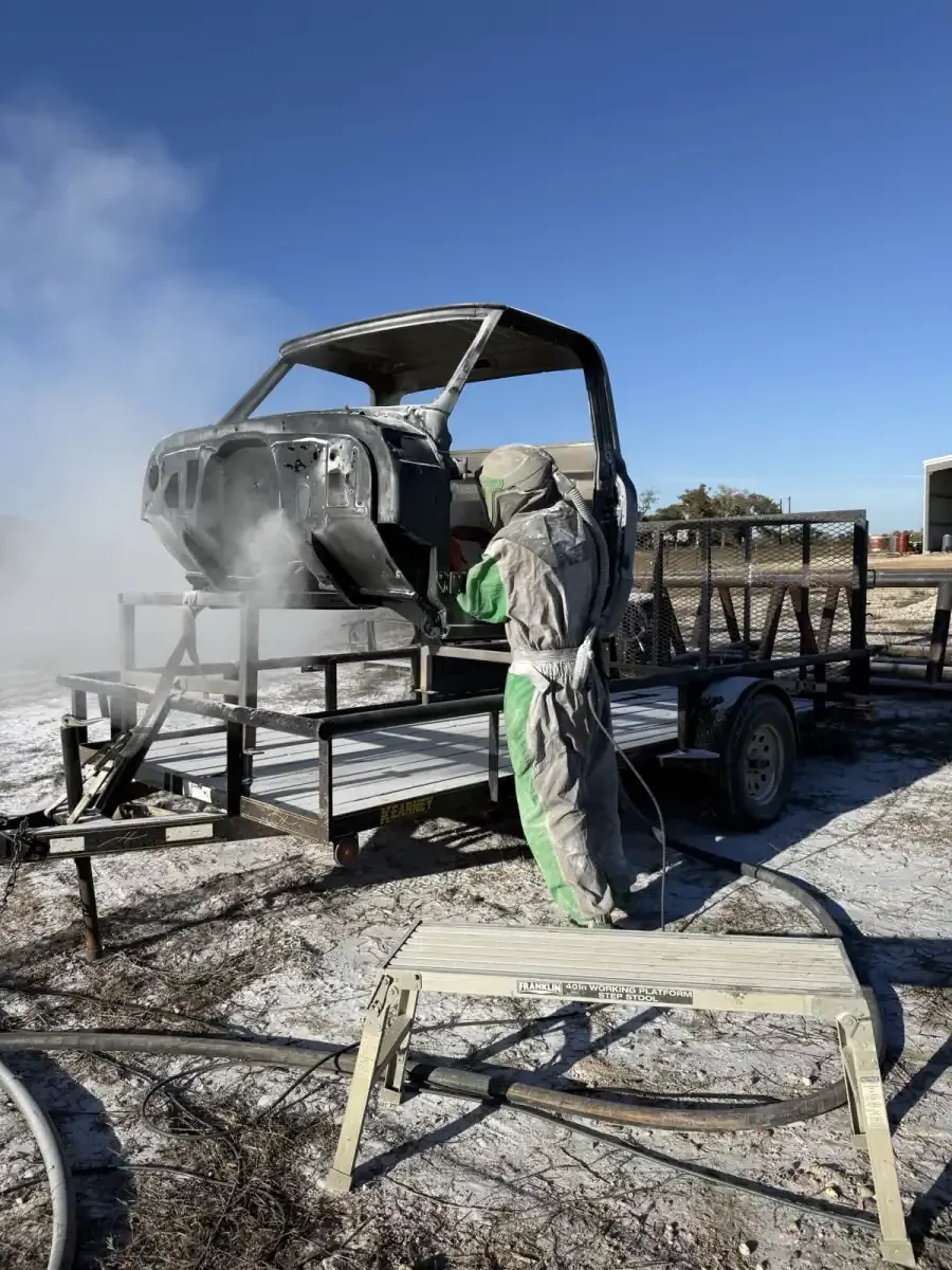 Truck cab being blasted